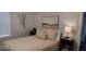 Cozy bedroom with a comfortable bed, neutral color palette, and stylish decorative accents at 18 S Franklin St, Greenfield, IN 46140