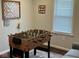 Fun recreation room featuring a foosball table and game-themed decor and lots of light at 18 S Franklin St, Greenfield, IN 46140