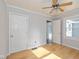 Bedroom with hardwood floor, neutral paint and ceiling fan at 1901 E 68Th St, Indianapolis, IN 46220