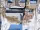 Aerial view of a house and surrounding buildings in a snow covered yard at 1913 S Talbott Se St, Indianapolis, IN 46225