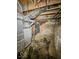 Unfinished basement with exposed pipes and brick walls at 1913 S Talbott Se St, Indianapolis, IN 46225