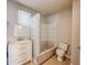 Updated bathroom with white vanity and tile shower at 1913 S Talbott Se St, Indianapolis, IN 46225
