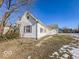 White house with gray roof, small yard, and partial snow cover at 1913 S Talbott Se St, Indianapolis, IN 46225