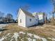 Back view of a white house with gray roof and maroon shutters at 1913 S Talbott Se St, Indianapolis, IN 46225