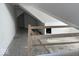 Unfinished attic space with open floor plan and railing at 2033 Carrollton Ave, Indianapolis, IN 46202