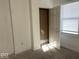 Bright bedroom featuring a closet and window with blinds at 2033 Carrollton Ave, Indianapolis, IN 46202