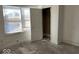 Bedroom with hardwood floors, window, and closet at 2033 Carrollton Ave, Indianapolis, IN 46202