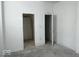 Spacious bedroom with ample closet space and large window at 2033 Carrollton Ave, Indianapolis, IN 46202