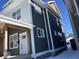 Side view of a duplex showcasing gray siding and white trim at 2033 Carrollton Ave, Indianapolis, IN 46202