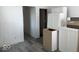 Unfinished kitchen with white cabinets and vinyl plank flooring at 2033 Carrollton Ave, Indianapolis, IN 46202
