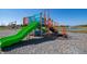 Community playground with green slides and bright colors overlooks a scenic pond and fountain at 2162 Warbler St, Danville, IN 46122