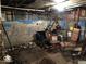 Unfinished basement with clutter and exposed utilities at 2165 S Meridian S St, Indianapolis, IN 46225
