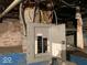 Unfinished basement with exposed wiring and a breaker box at 2165 S Meridian S St, Indianapolis, IN 46225
