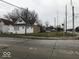 House exterior view, located on a corner lot with street parking at 2165 S Meridian S St, Indianapolis, IN 46225