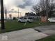 Side view of the house with parking and a street visible at 2165 S Meridian S St, Indianapolis, IN 46225