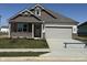 Charming single-story home featuring a brick and siding facade, well-kept lawn, and attached two-car garage at 2190 Warbler St, Danville, IN 46122