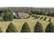 An aerial view of a sprawling estate including a charming house, barn, and expansive lawn at 21989 Schulley Rd, Cicero, IN 46034