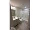 Clean basement bathroom with tub and vanity at 2208 Walnut Frk Dr, Whitestown, IN 46075