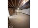 Unfinished basement with exposed beams and concrete floor at 2208 Walnut Frk Dr, Whitestown, IN 46075