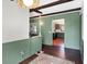 Dining area with wood floors and an open view to the kitchen at 2210 Holden Dr, Anderson, IN 46012