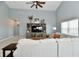 Relaxing living room featuring built-in shelving and large TV at 2230 Shadow Trace Way, Greenwood, IN 46143