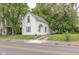 Quaint white house with small yard and driveway at 230 W 22Nd St, Anderson, IN 46016