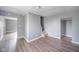 Gray walls, wood floors, and an open floor plan with visible stairs at 230 W 22Nd St, Anderson, IN 46016