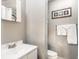 Bathroom features a toilet, white towels, vanity and shower at 361 S Spencer Ave, Indianapolis, IN 46219