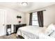 Bedroom featuring plush carpet, dark curtains, and a large window at 361 S Spencer Ave, Indianapolis, IN 46219