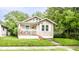 Charming single-story home featuring a cozy front porch and well-maintained lawn at 361 S Spencer Ave, Indianapolis, IN 46219