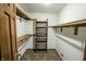 Large walk-in closet with shelves and hanging rods at 3819 S Village Dr, New Palestine, IN 46163