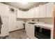 Laundry room with built in cabinets and new appliances at 3819 S Village Dr, New Palestine, IN 46163