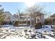 House's back with deck, arbor, and snowy landscape at 502 Elnora Ln, Westfield, IN 46074