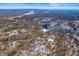 Aerial view of a snowy wooded area with several houses visible at 5155 W Big Hurricane Rd, Martinsville, IN 46151