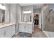 Elegant bathroom with double sinks, walk-in shower, and access to a closet at 5246 Parkhurst Xing, McCordsville, IN 46055