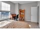 Relaxing bedroom with a desk and bookcase near the window at 5246 Parkhurst Xing, McCordsville, IN 46055