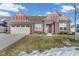 Brick ranch home with a two-car garage and landscaped lawn at 5246 Parkhurst Xing, McCordsville, IN 46055