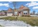 Two-story brick home with a front yard and mature tree at 5246 Parkhurst Xing, McCordsville, IN 46055