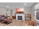 Spacious living room featuring a fireplace, hardwood floors, and ample natural light at 5246 Parkhurst Xing, McCordsville, IN 46055
