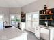 Modern bar with white cabinets and herringbone tile at 5465 S State Road 75, Jamestown, IN 46147