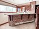 Basement bar with brick facade and granite countertop at 5465 S State Road 75, Jamestown, IN 46147