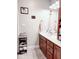 Clean bathroom with wood vanity and updated fixtures at 5465 S State Road 75, Jamestown, IN 46147