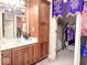 Bathroom with a wood vanity and access to a walk-in closet at 5465 S State Road 75, Jamestown, IN 46147