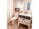Updated bathroom with a farmhouse-style vanity and tiled floor at 5465 S State Road 75, Jamestown, IN 46147