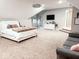 Large bedroom with plush carpet and a comfy seating area at 5465 S State Road 75, Jamestown, IN 46147