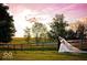 Bride and groom pose for a photo at sunset at 5465 S State Road 75, Jamestown, IN 46147