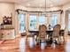 Bright dining room with large windows and a rustic wooden table at 5465 S State Road 75, Jamestown, IN 46147