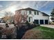 White brick house with a three-car garage and manicured landscaping at 5465 S State Road 75, Jamestown, IN 46147