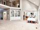 Spacious great room featuring built-in shelving and views into adjacent rooms at 5465 S State Road 75, Jamestown, IN 46147