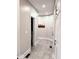 Clean hallway with tile floors and access to bathroom at 5465 S State Road 75, Jamestown, IN 46147